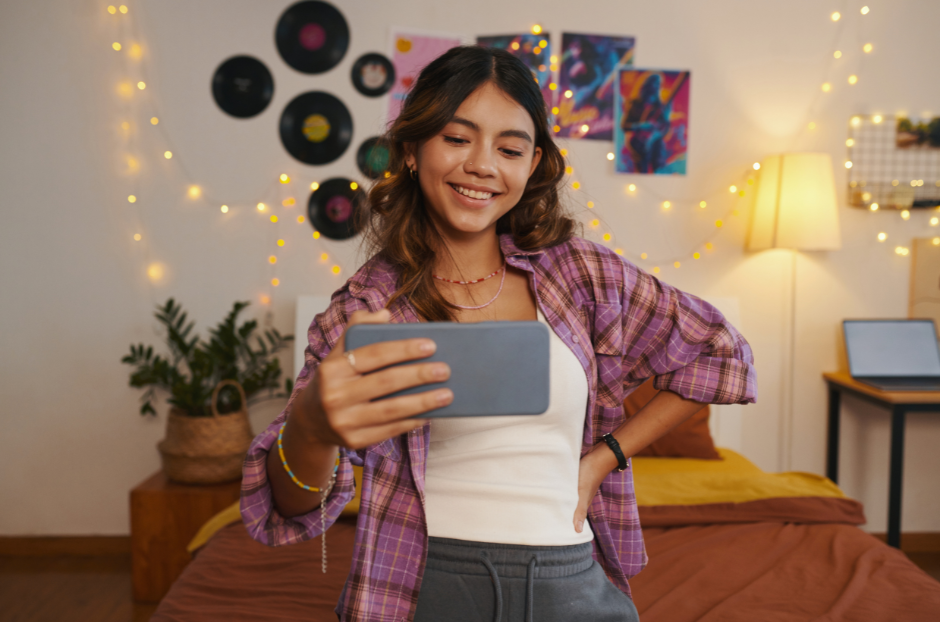 Content creator filming herself on a smartphone